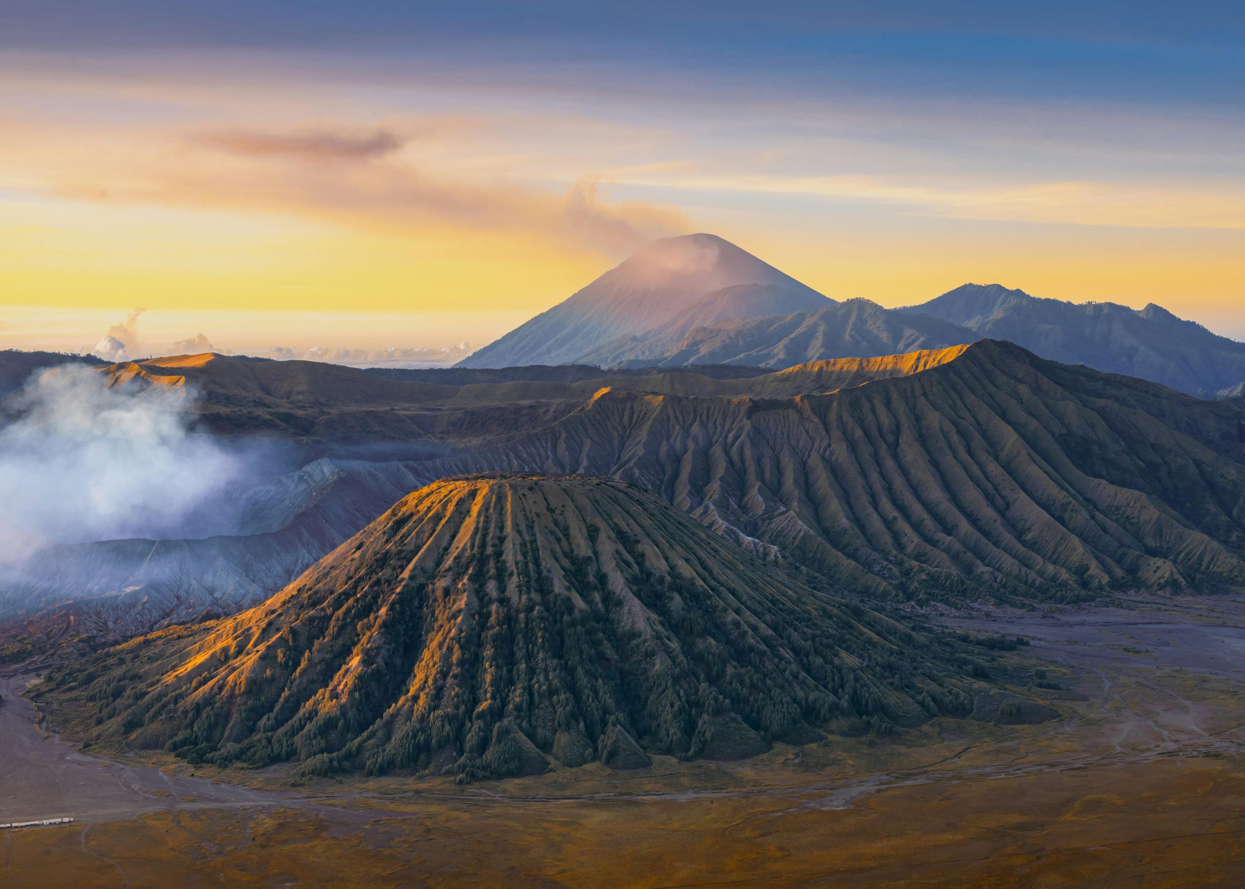 Breathtaking view of Mount Bromo at sunrise showcasing volcanic landscape in Indonesia.